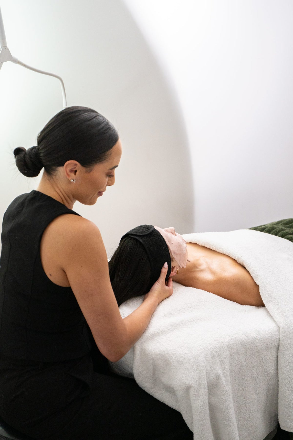 Skin therapist performing a facial massage