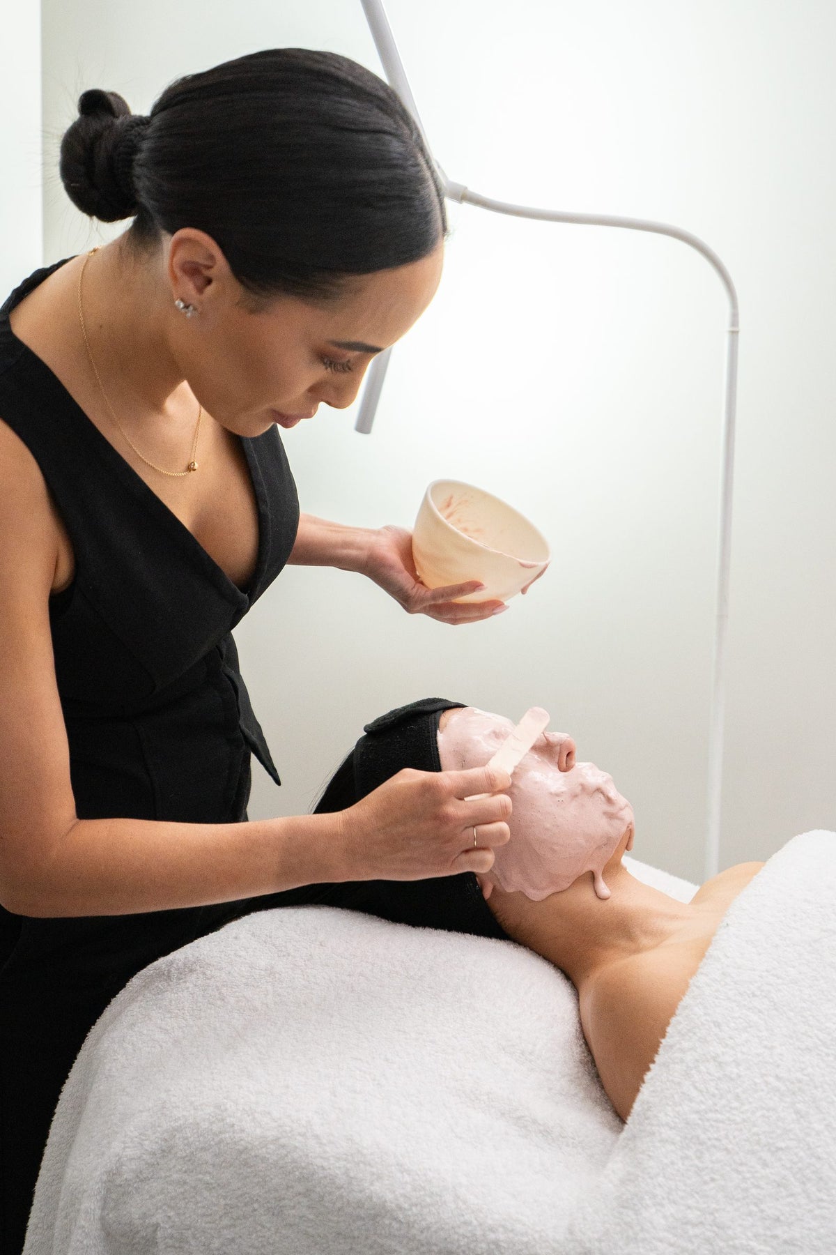 Skin therapist preparing a facial mask